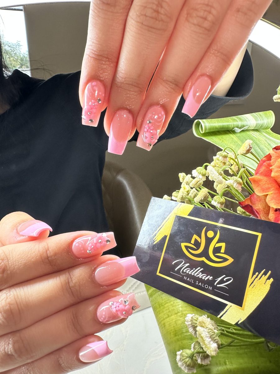 Hands with gel polish being prepared for removal